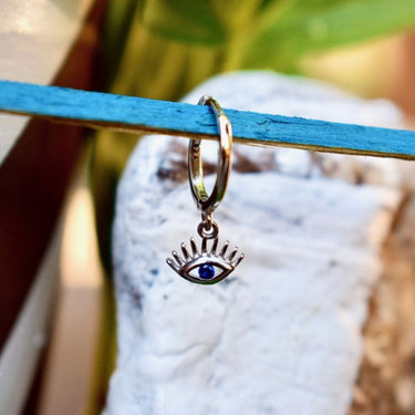 bohemian huggie hoop all seeing eye